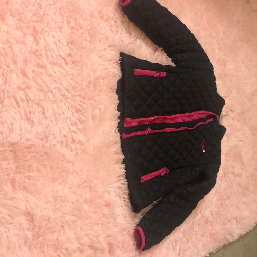 A black and hot pink jacket